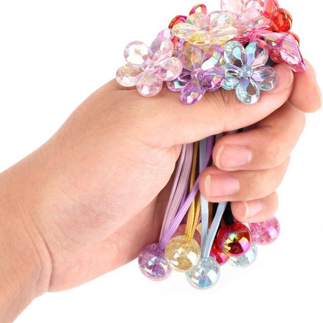 Élastiques à cheveux en perles camélia colorées : accessoires de coiffure élégants pour petites filles