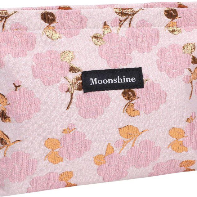 Trousse de maquillage rose en toile : l'accessoire incontournable pour les femmes en voyage